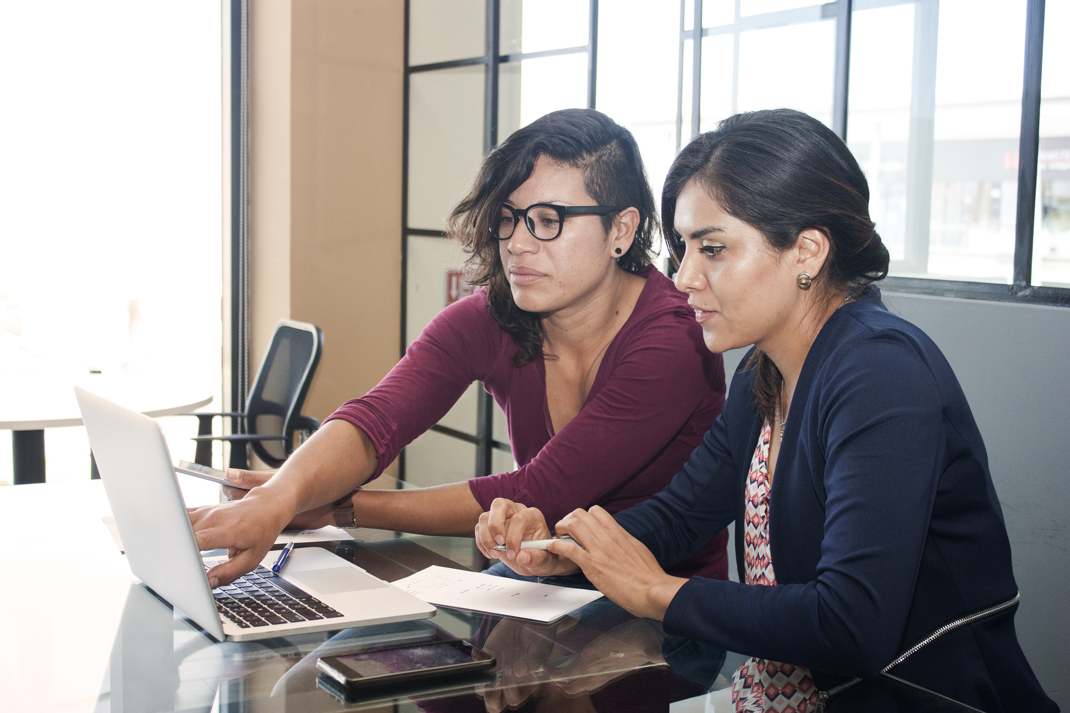 Clinical staff collaborating at a desk
